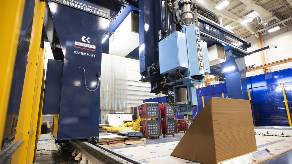 A cross section of an exterior wall of a house is being printed on a 3D printer at the University of Maine's Advanced Structures & Composite Center on Oct. 12, 2023, in Orono, Maine. (AP Photo/Kevin Bennett)