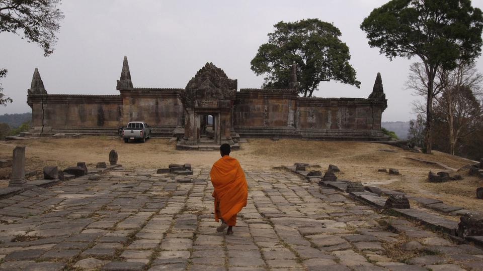 A Cambodian Buddhist monk walks toward the Cambodia's 11th century Hindu Preah Vihear temple, which was enlisted as UNESCO's World Heritage site in Preah Vihear province, about 245 kilometers (152 miles) north of Phnom Penh, Cambodia Tuesday, Feb. 8, 2011. (AP Photo/Heng Sinith, File)