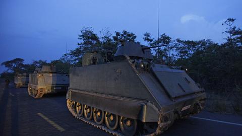 Thai soldiers on armored personnel carriers take a position at the border during fighting between Thailand and Cambodia in Surin province, northeastern Thailand Tuesday, April 26, 2011. (AP Photo/Sakchai Lalit, File)