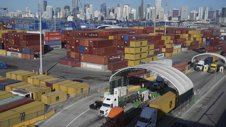 Tractor-trailers line up to enter PortMiami Thursday, Aug. 7, 2025. (AP Photo/Marta Lavandier)