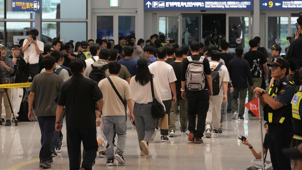 South Korean workers released after days of detention in Georgia arrive at the Incheon International Airport, in Incheon, South Korea, Friday, Sept. 12, 2025. (AP Photo/Ahn Young-joon)  Photo Details (1 of 5) Date	 Sep 12, 2025 2:01 PM Headline	 South Korea Hyundai Workers Source	 AP