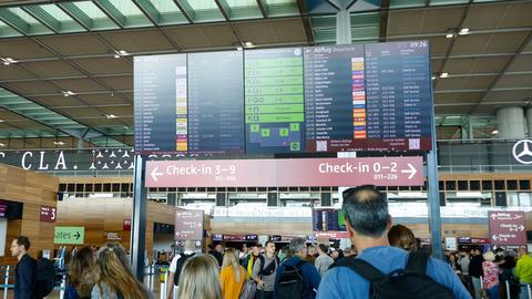 People at BER airport as a cyber attack has caused delays, in Berlin, Germany, Saturday, Sept. 20, 2025. (Carsten Koall/dpa via AP)