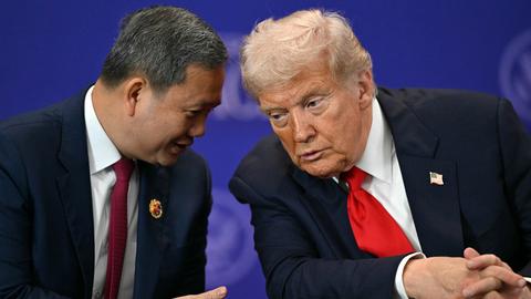 U.S. President Donald Trump listens to Cambodia's Prime Minister Hun Manet, left, ahead of the ceremonial signing of a ceasefire agreement between Thailand and Cambodia on the sidelines of the 47th Association of Southeast Asian Nations (ASEAN) summit in Kuala Lumpur, Malaysia, Sunday, Oct. 26, 2025. (Mohd Rasfan/Pool Photo via AP)
