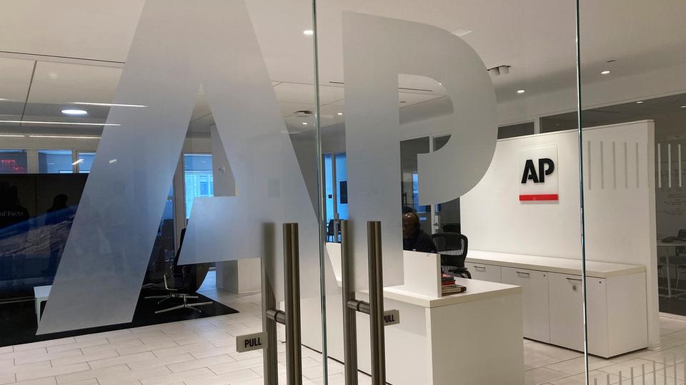 FILE - The Associated Press logo is shown at the entrance to the news organization's office in New York, July 13, 2023. (AP Photo/Aaron Jackson, File)