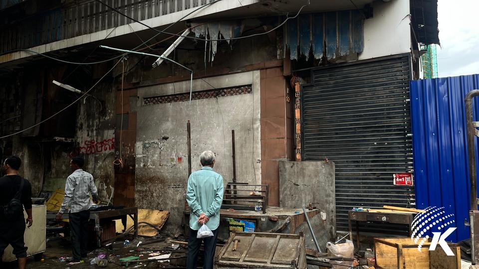 So Phanny, 68, a former resident of the Angkor Meanchey building, came to witness the place he once called home take its first steps toward demolition as the excavators rolled in on October 13. Kiripost/ Kuch Sikol
