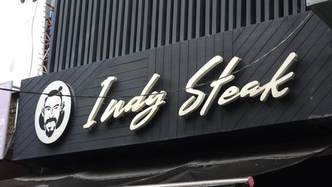 Indy Steak, a popular Phnom Penh restaurant, is known for its grilled meats and the compelling story of its founder, Hem Mak Sothea.